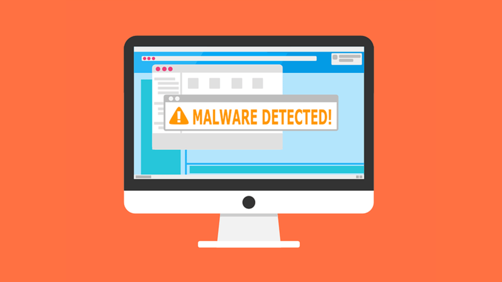 computer monitor with malware detected warning on it